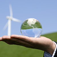 photo of a globe in the palm of a hand