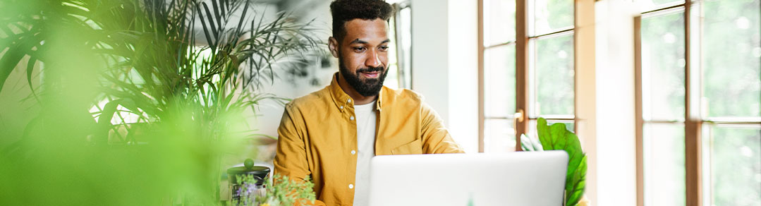 Man sitting at desk on computer