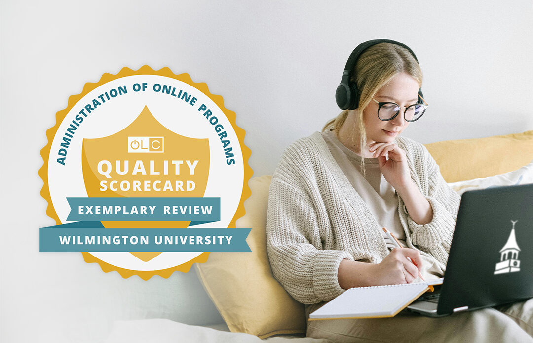 Woman sitting while working on a laptop.