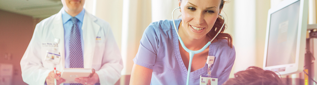 Nurse listening to patient heart beat