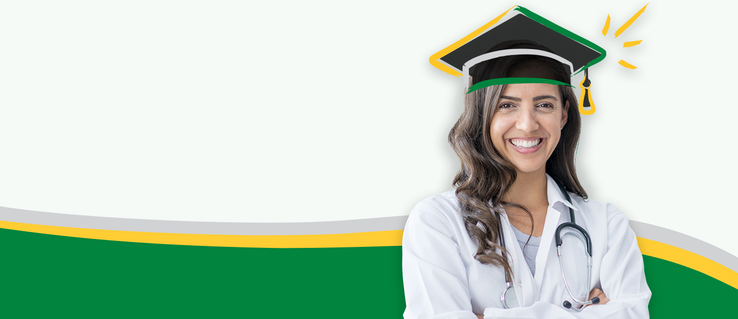 A woman wearing a medical coat, with her arms crossed and smiling with a graduation cap on her head