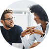 Two people smiling at each other.
