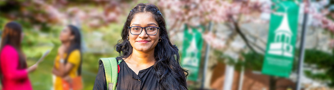 Student Sitting and Smiling