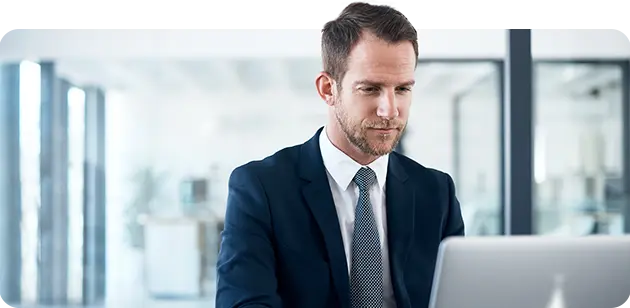 Man studying on laptop.