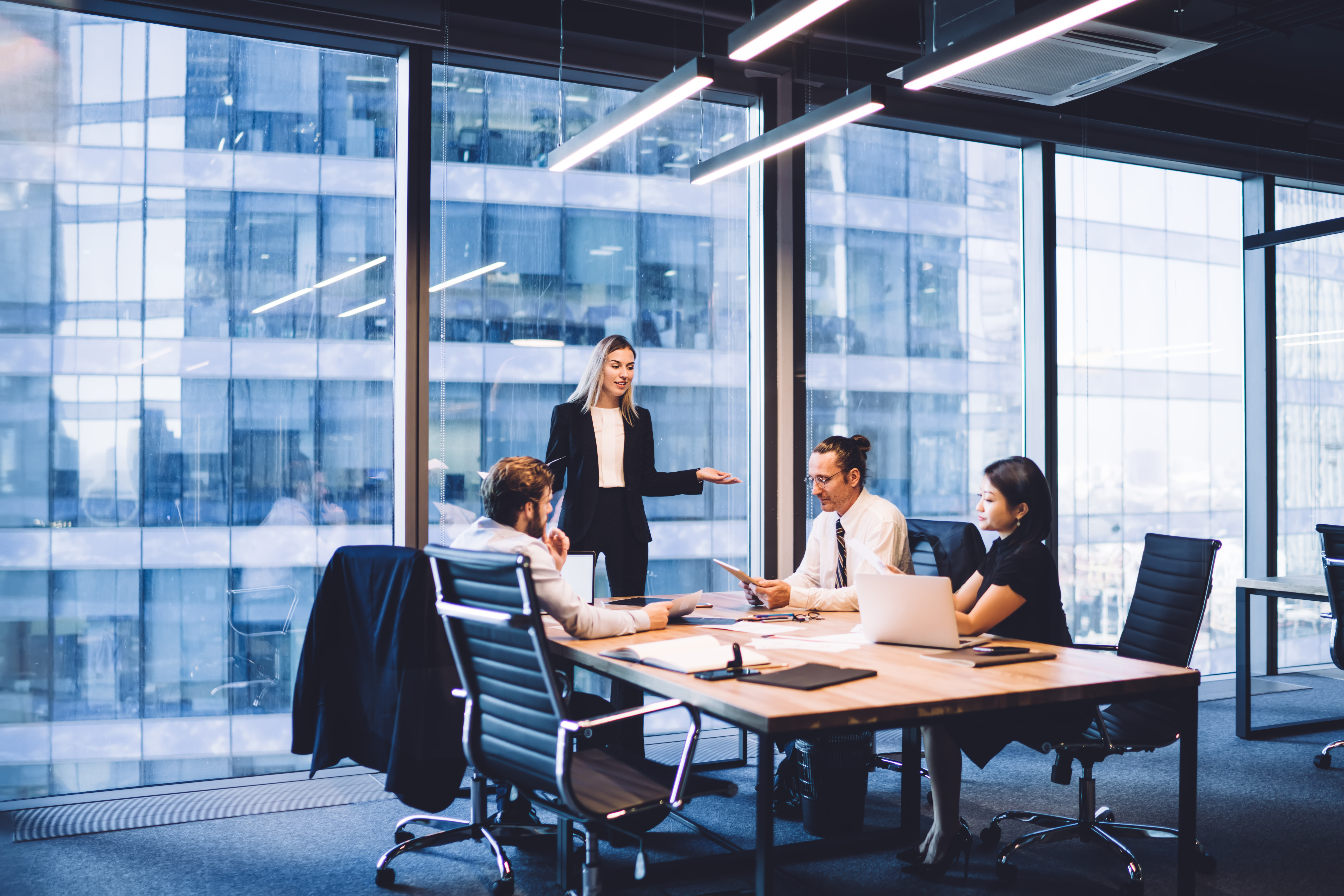 People in a conference room in a tall office building