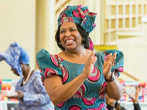 Woman smiling and clapping