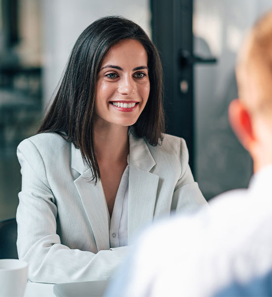 Woman sitting talking to another person