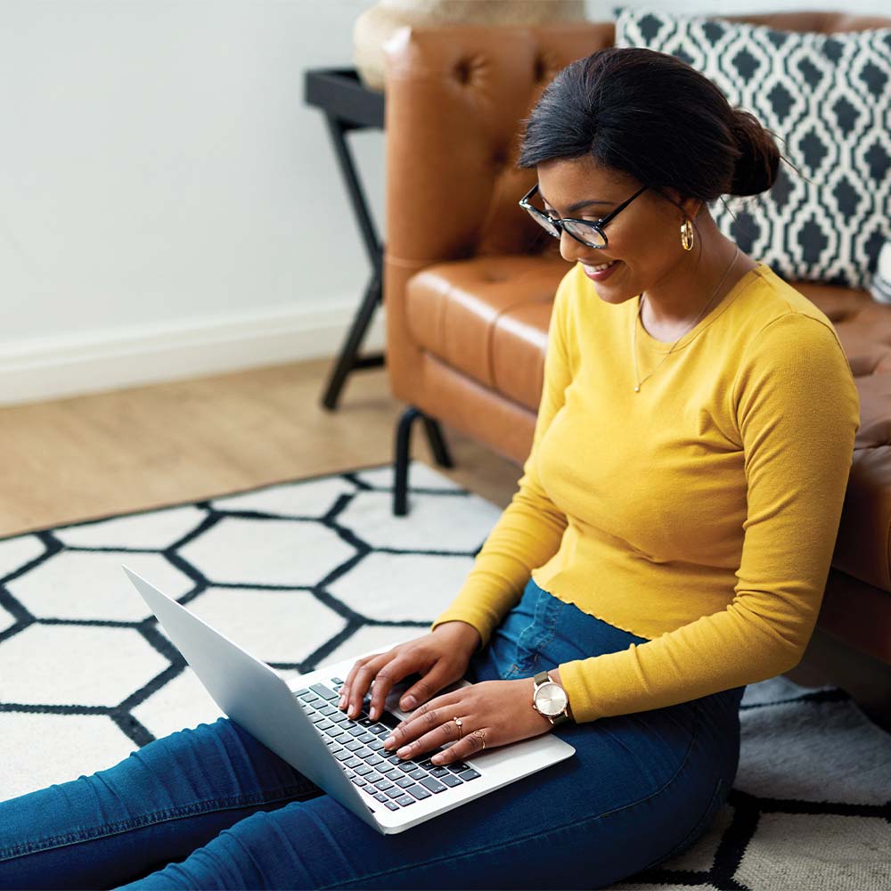 a picture of a student working at home on a laptop