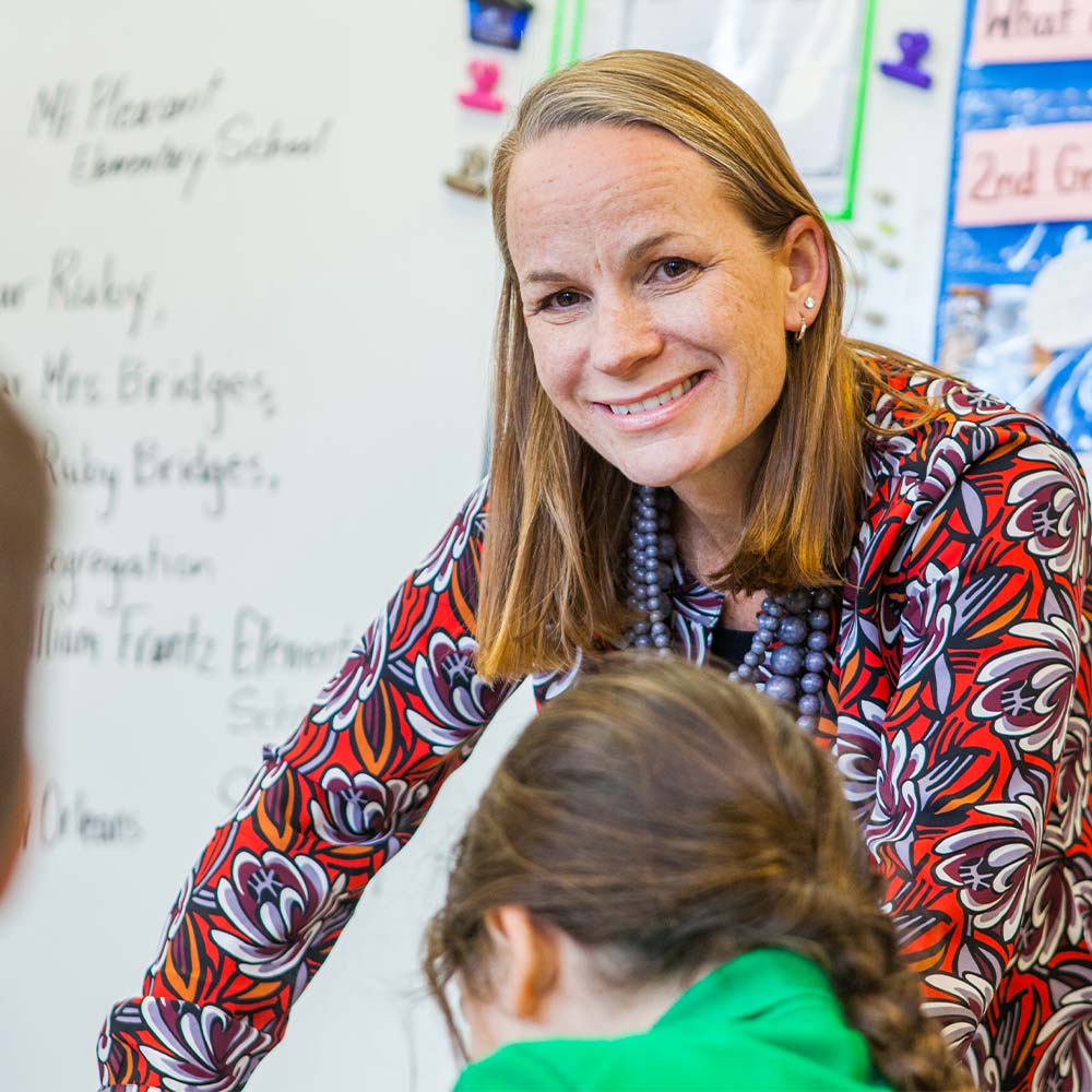 a picture of a teacher with a student